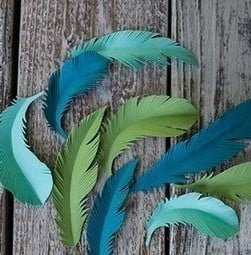 Paper feathers with their hands