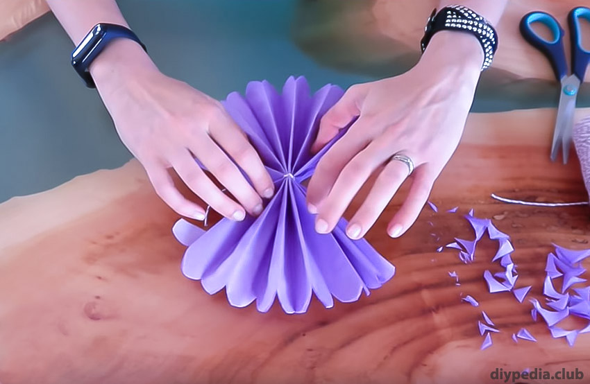 folding the petals out of paper